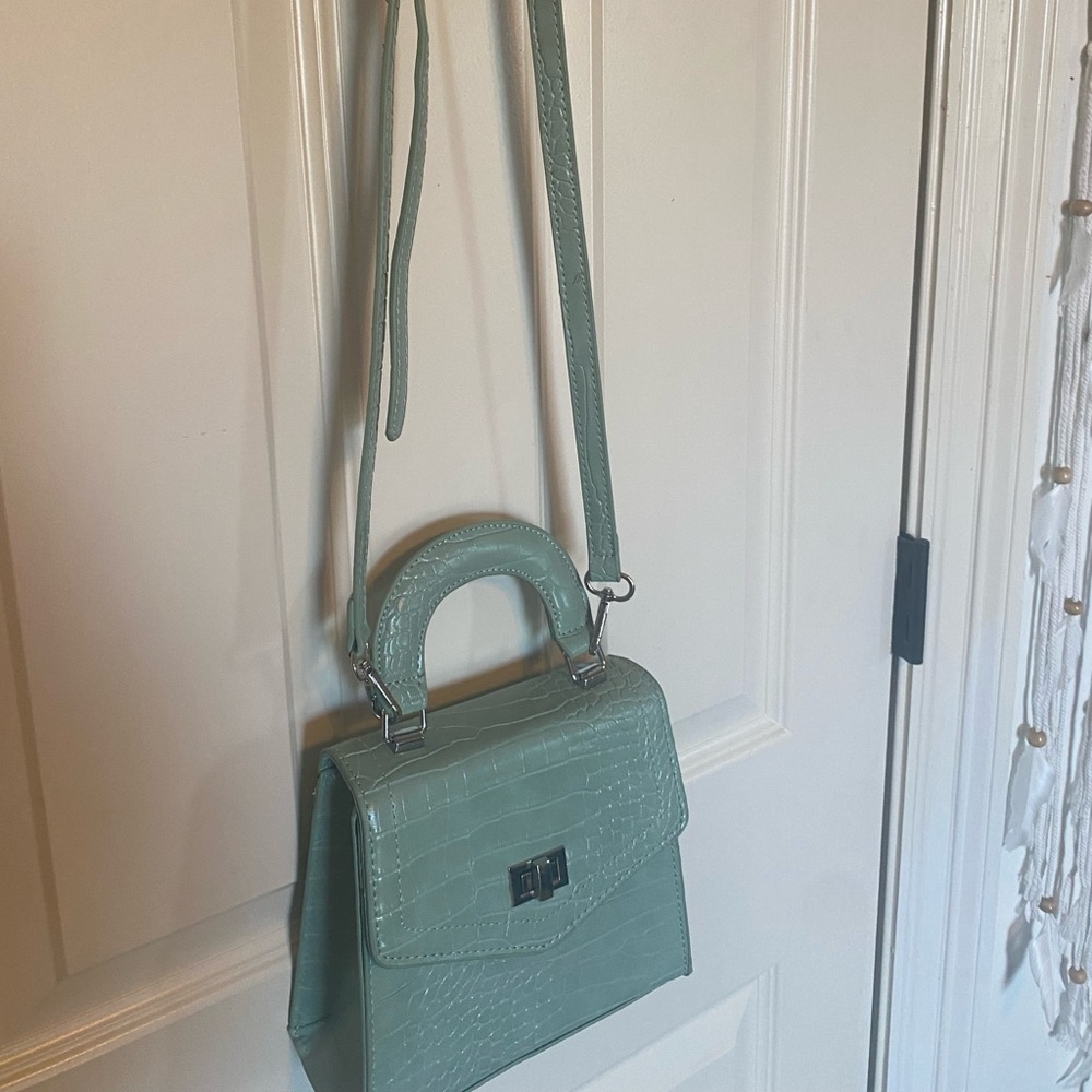 A green crossbody purse